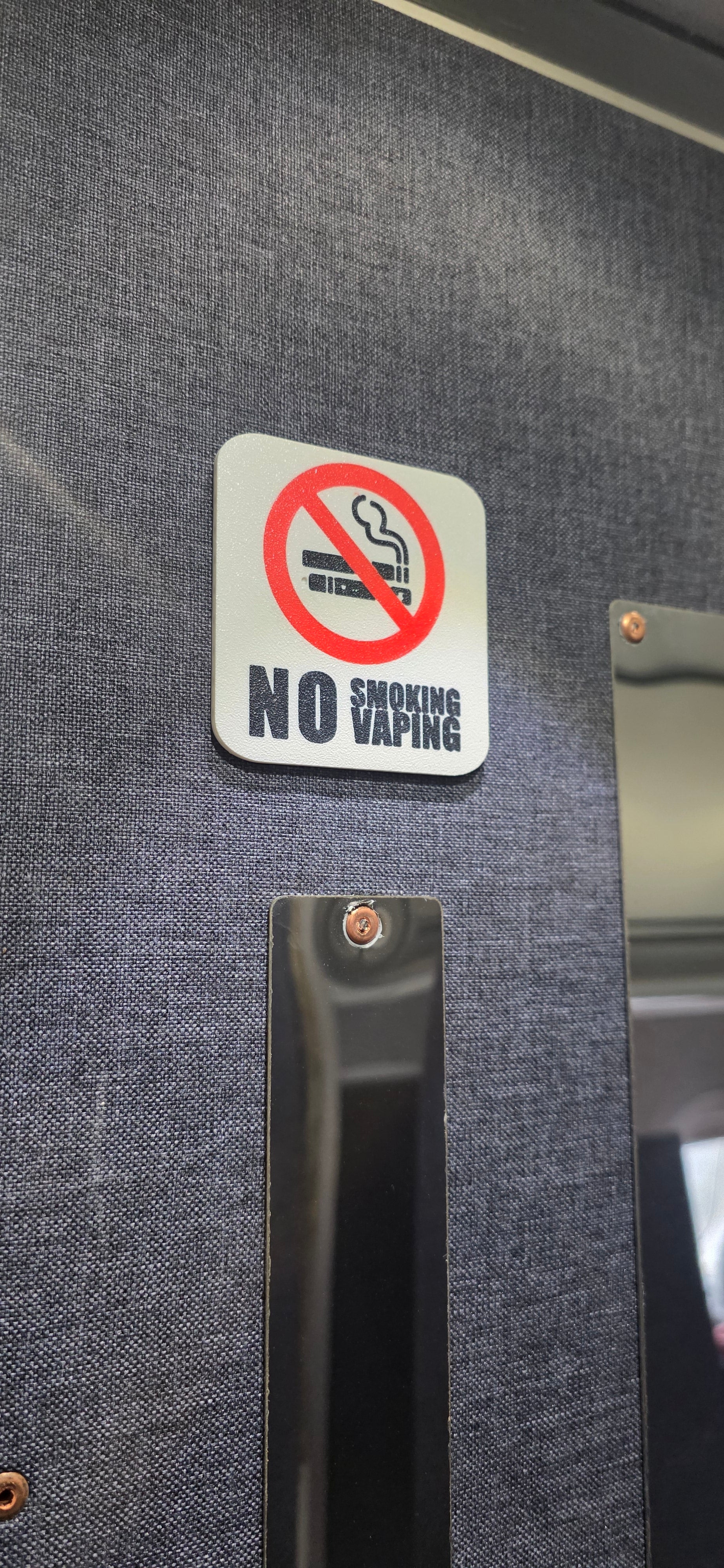 No smoking sign on a car door panel aircraft bertie meeks