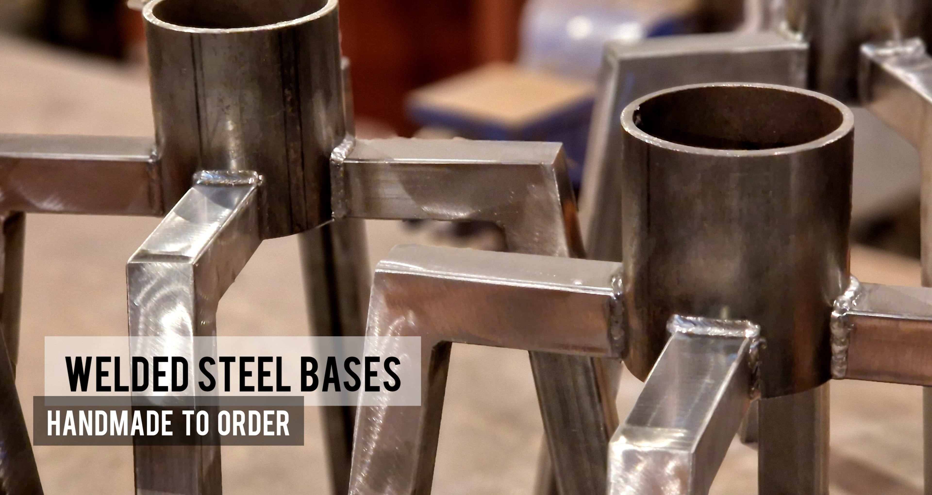 Welded steel bases with text indicating they are handmade to order and sourced from dwellerlife.com. handmade bar stools UK
